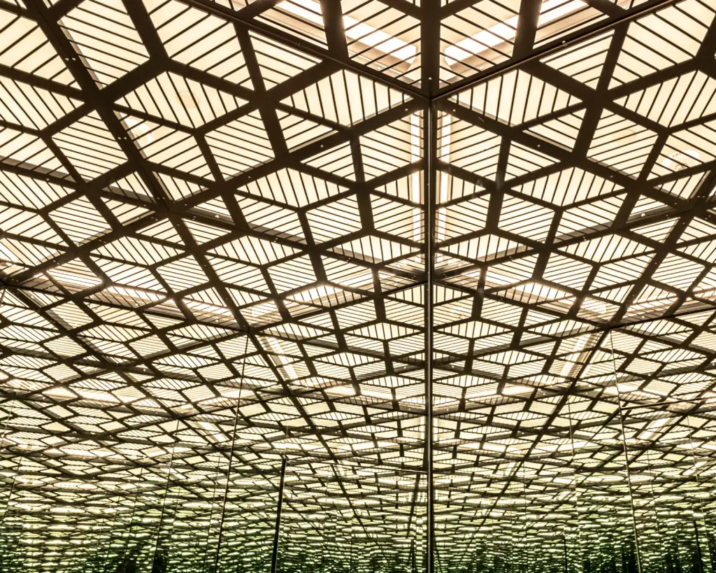 Image of a geometric lit up ceiling.