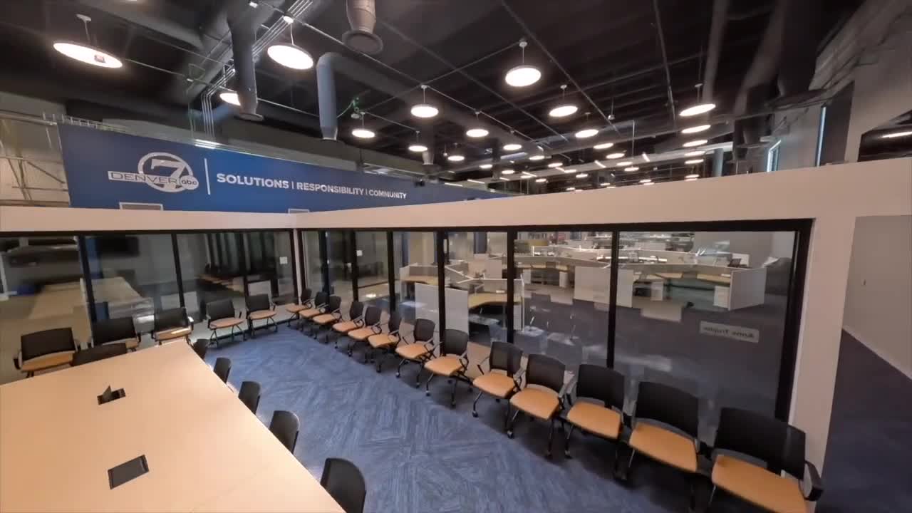 SCRIPPS-DENVER-INTERIOR-1 Image of Scripps Denver 7 studio interior with chairs and large glass windows.