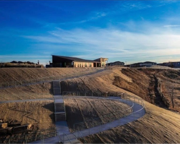 Aerial view of newly built Bluff Lake Nature Center with blue sky in the background.