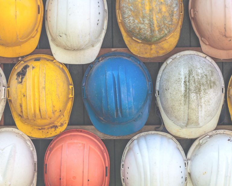 Variety of colorful construction hard hats.
