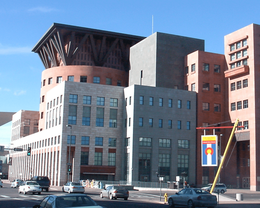 Exterior of the Denver Central Library with grey boxy buildings and modern brick.